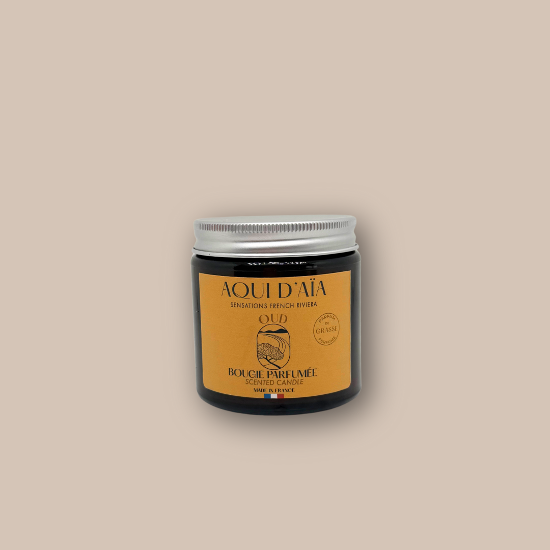 Bougie artisanale parfum bois de oud 100 g, présentée dans un contenant décoratif