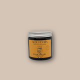 Bougie artisanale parfum bois de oud 100 g, présentée dans un contenant décoratif