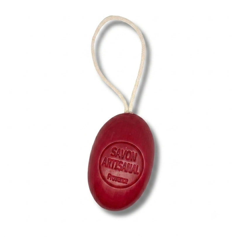 Savon ovale sur corde au parfum de fruit de la passion.